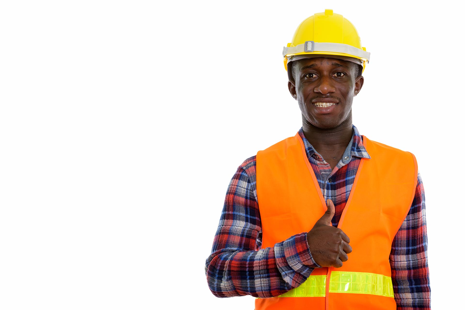 Studio shot of young happy black African man construction worker